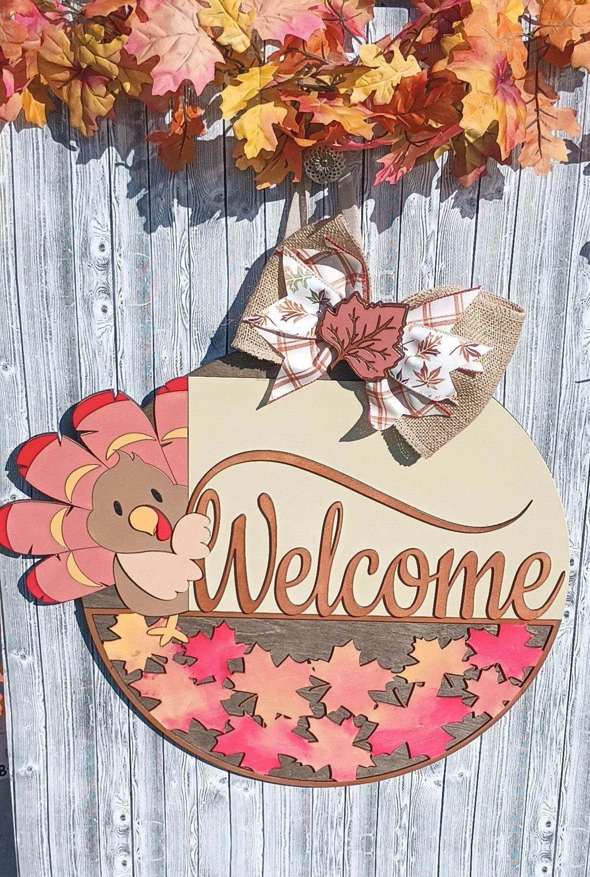 Thanksgiving door hanger with layered 3D wood design and colorful maple leaves