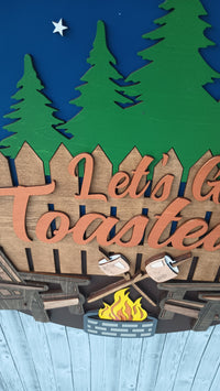 Thumbnail for 18-inch camping door sign with campfire design and pine tree silhouette, perfect for RV
