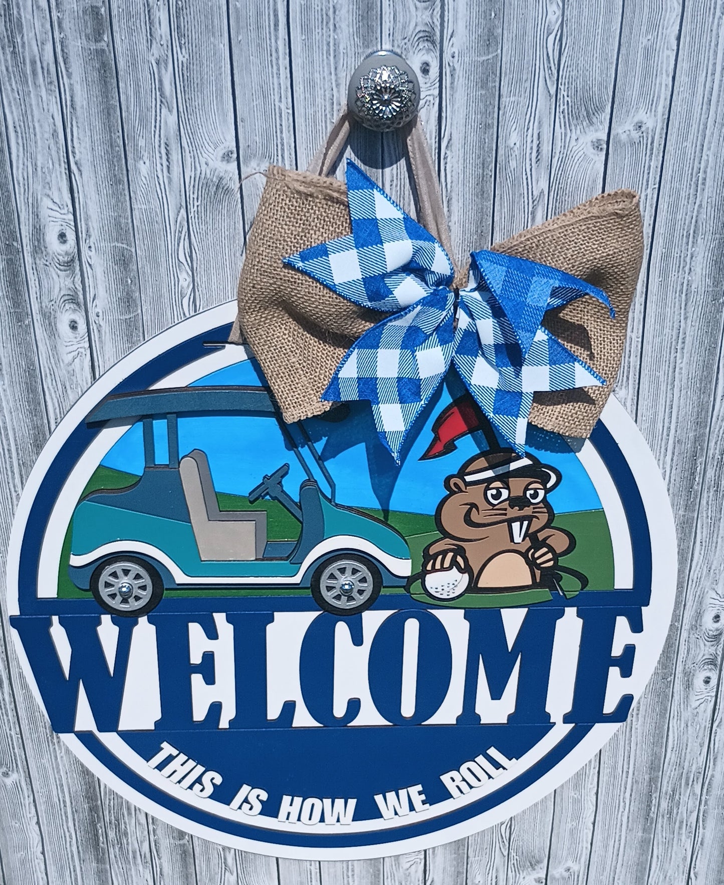 Golf door hanger with gopher character and golf cart, ideal for golfers and clubhouse decor.