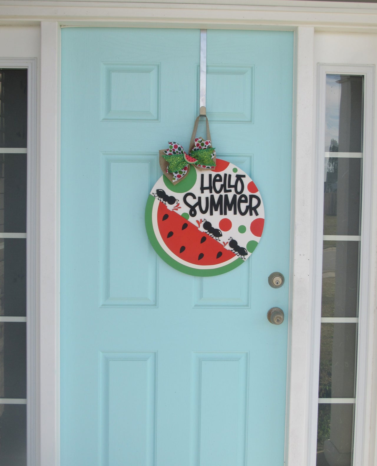 Bright red and green watermelon door hanger with hand-painted 3D layers, ideal for summer entryway decor.
