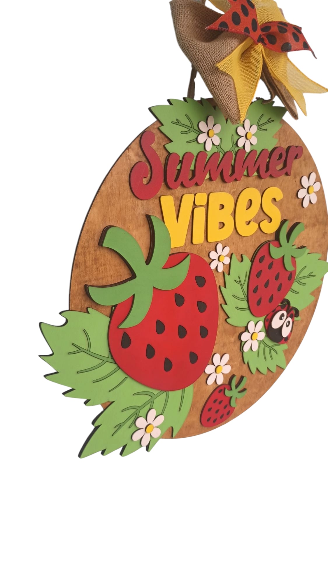 Handcrafted strawberry sign with layered wood and colorful bow