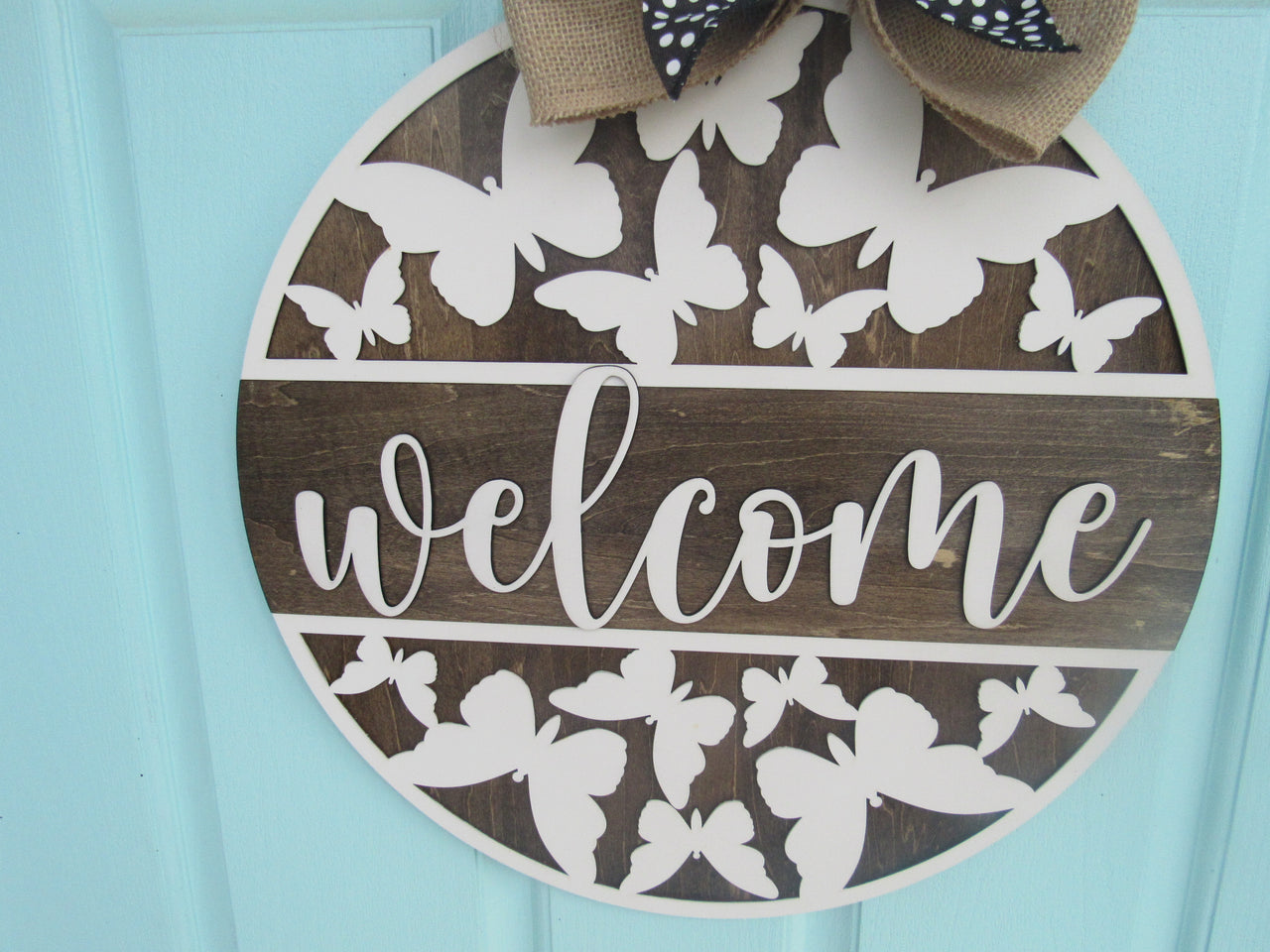 handmade butterfly door hanger with layered bow and white lettering