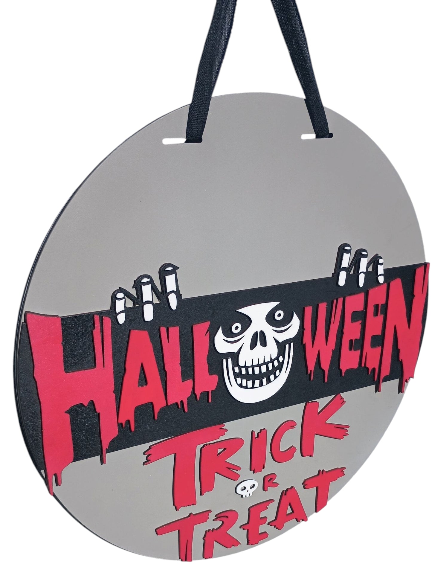 Spooky gray door sign with trick or treat message and skull