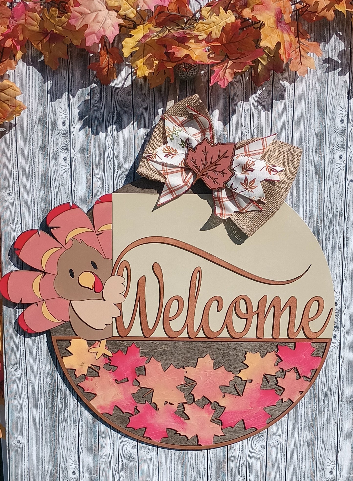 Welcome sign with cute turkey, burlap ribbon, and maple leaf accents for fall
