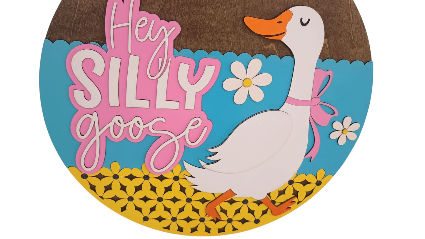 Whimsical door sign with white goose and pink lettering