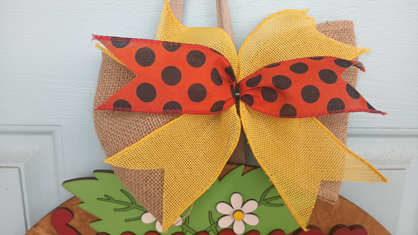 Wooden summer door sign with red strawberries and yellow bow