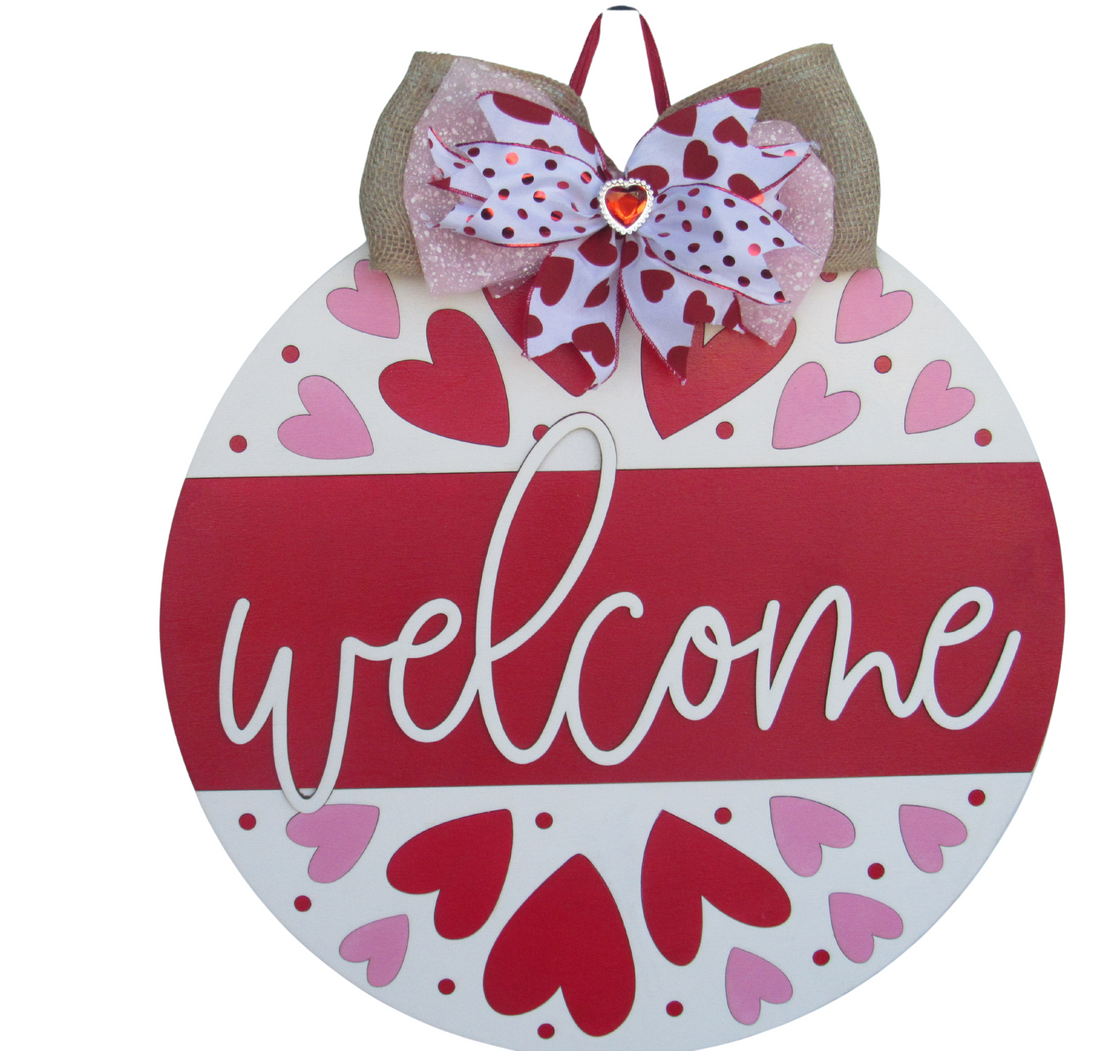 18-inch round Valentine door hanger for front door decor, featuring a hand-painted heart design and decorative bow for seasonal charm.