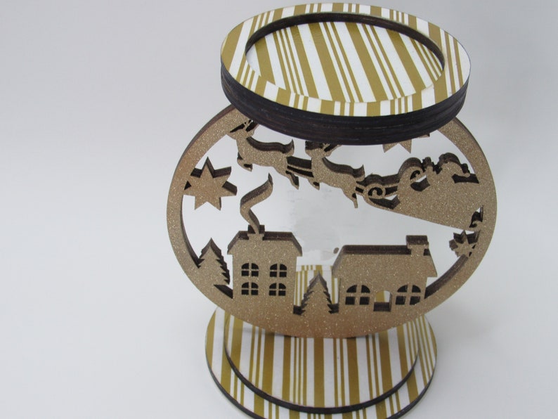 3-wick gold glitter candle holder featuring Santa sleigh and reindeer, handmade for festive table or mantle display.