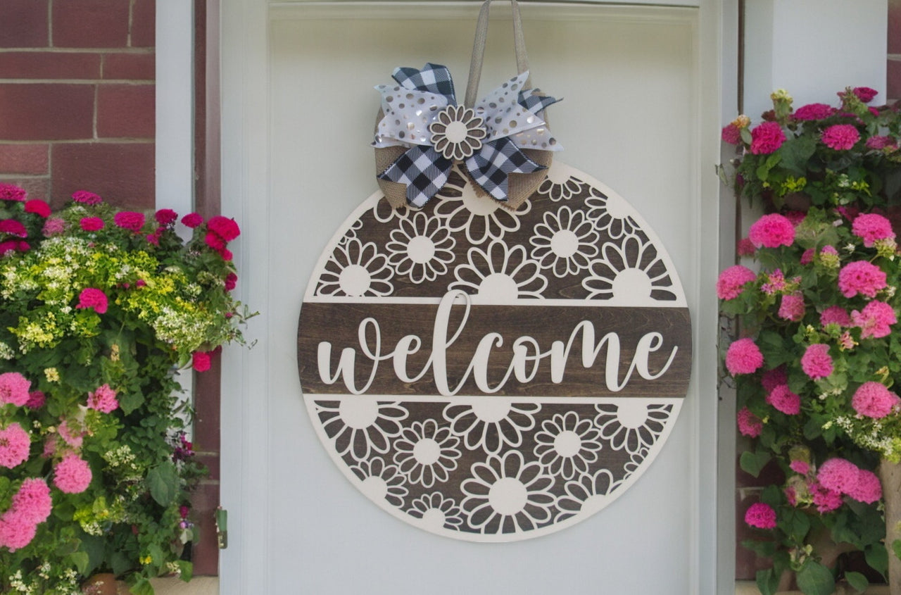 Custom wooden summer door hanger with white daisy floral design, welcome script, and ribbon bow for home decor.