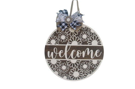 Round wooden summer door hanger with daisy design, welcome text, and decorative bow for front porch or wall decor.
