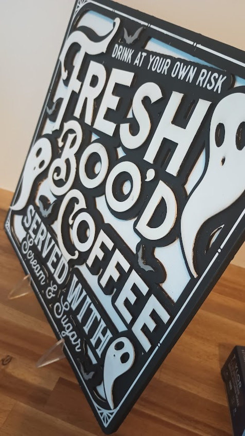 Wall art featuring "Fresh Boo'd Coffee" sign for a Halloween coffee station.