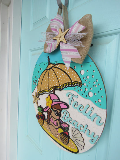 Colorful beach house decor featuring polka dot beach umbrella and whimsical text