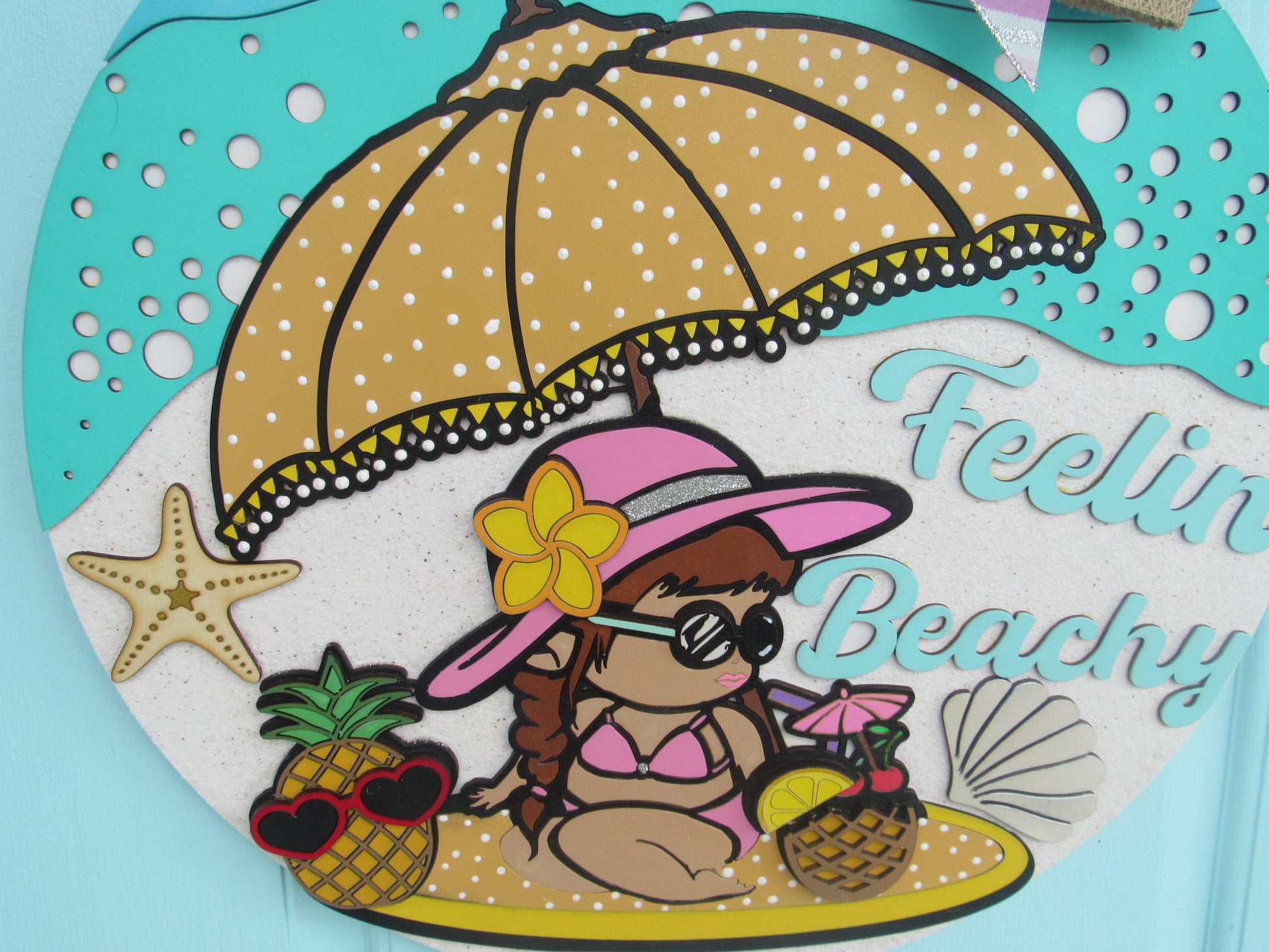 Cute beach-themed door hanger with pineapples, shells, and layered ribbon bow