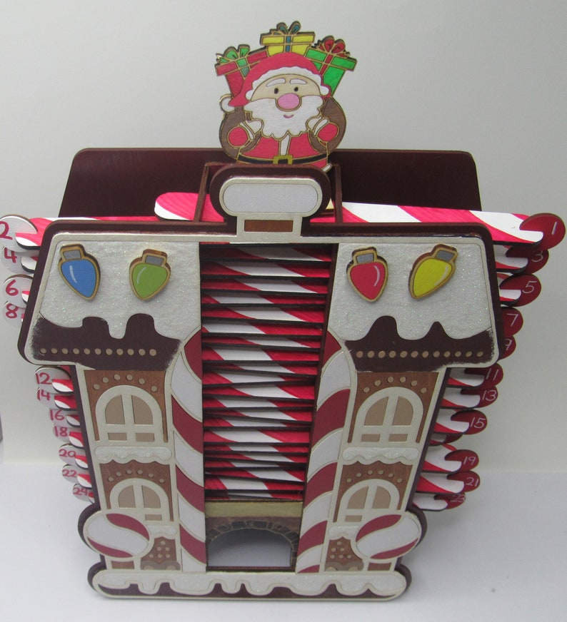 Decorative Santa's workshop advent calendar with candy cane accents for Christmas