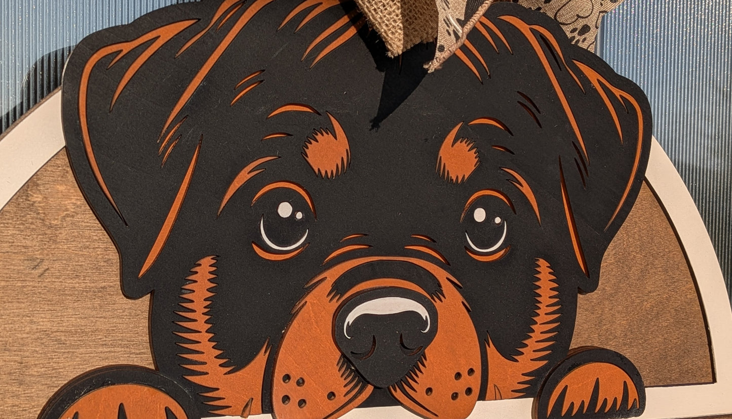 Rottweiler door hanger sign hanging on a wooden front door