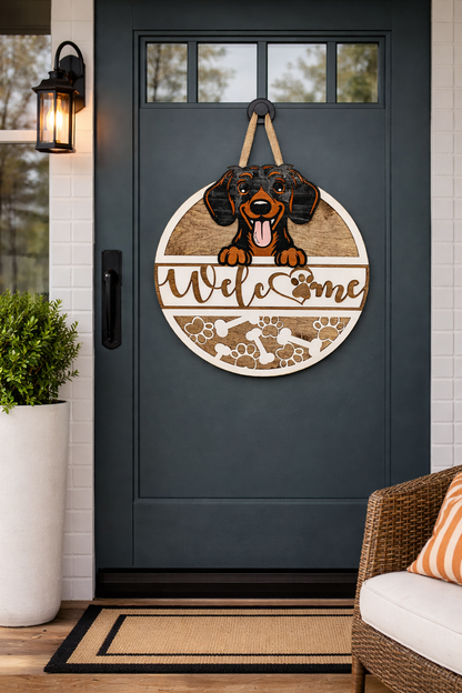 Decorative door sign with a dachshund illustration and WELCOME text on a dark gray door.