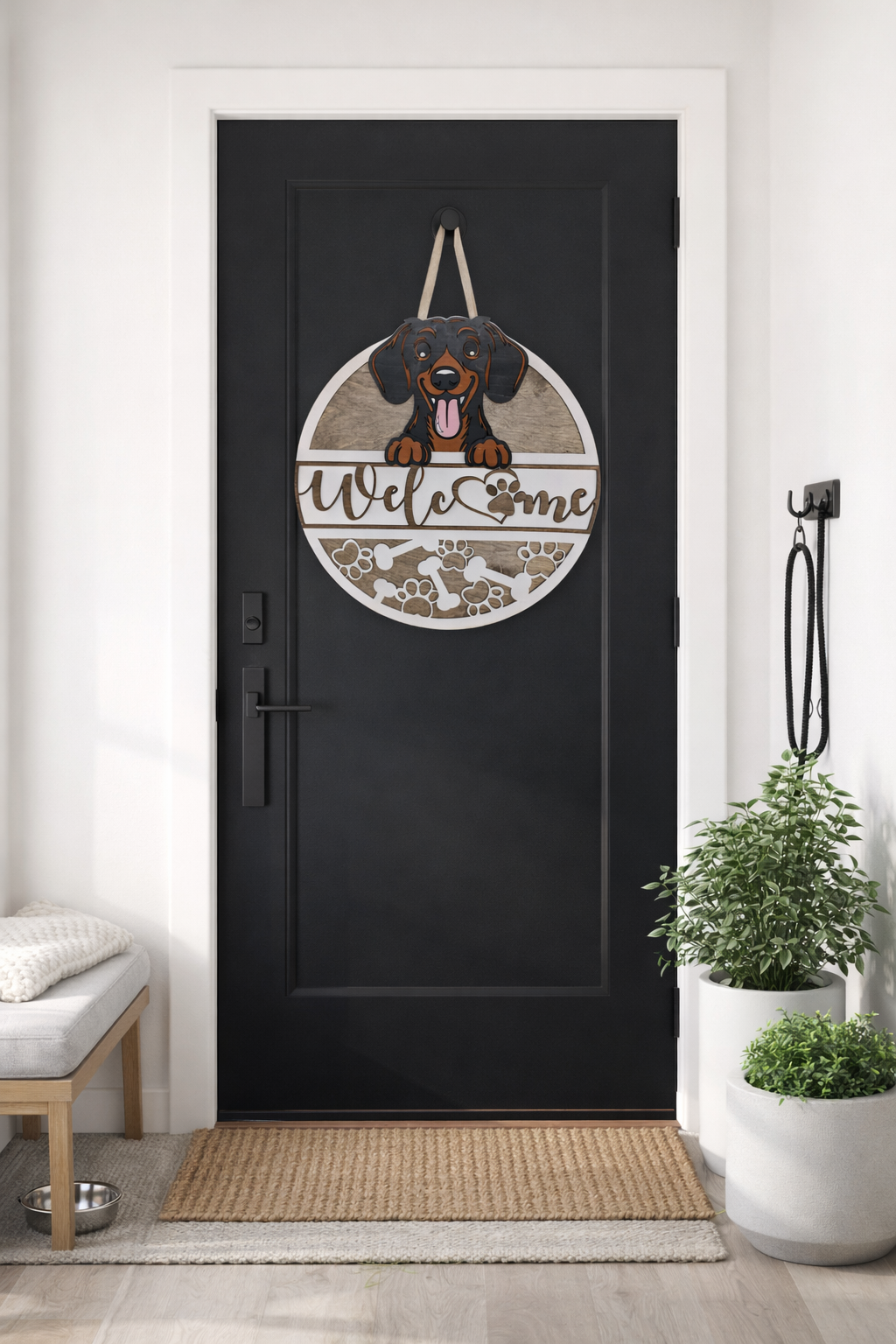 Decorative door hanger with a dachshund  dog design on a black door in a home setting.