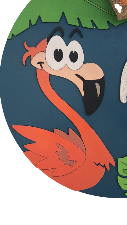 summer front door decor with flamingo and green leaf accents
