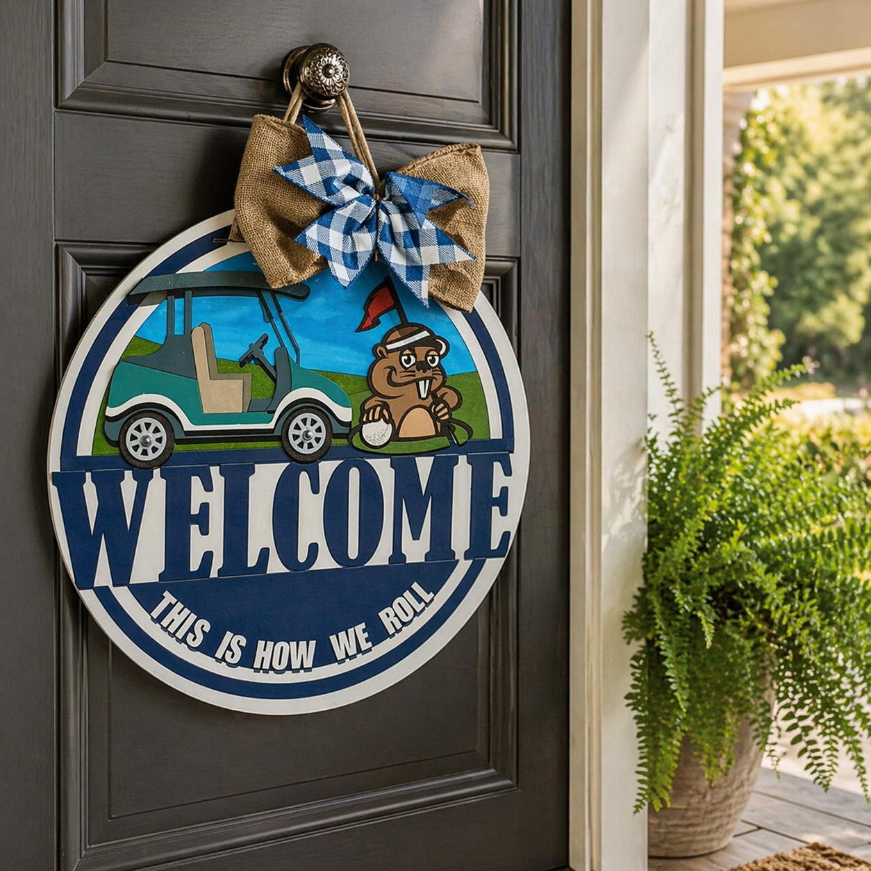 Decorative door sign with a cartoon gopher and golf cart, featuring the text 'Welcome, This is How We Roll', on a dark wooden door.