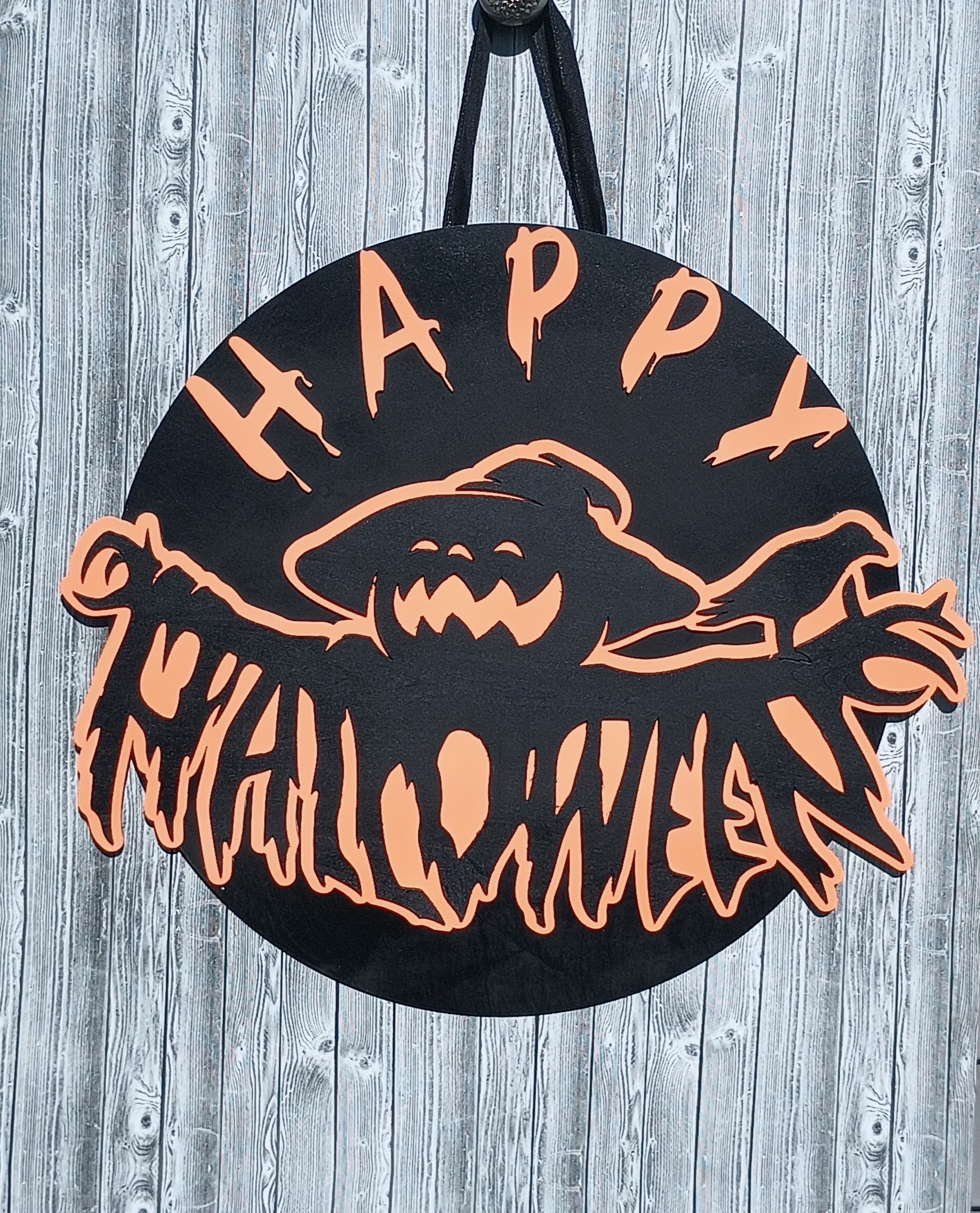 Spooky Halloween sign with ghost and “Happy Halloween” text