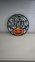 Hand-painted Halloween Trick or Treat sign featuring glitter bats and bold layered lettering for festive wall or door display.