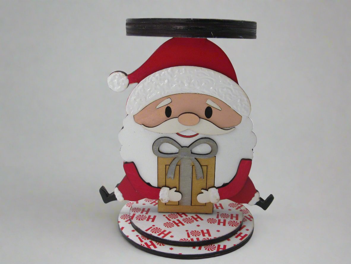 Close-up of the Wooden Santa Candle Holder highlighting detailed craftsmanship and festive paper base design.