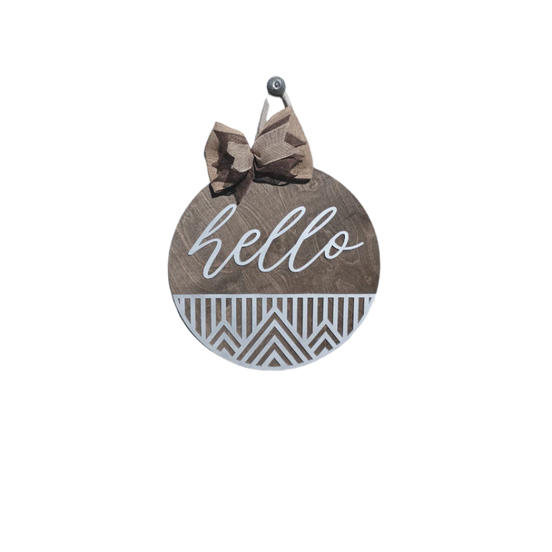Wood round welcome sign with white script "hello" text and burlap bow, ideal for front door decoration.