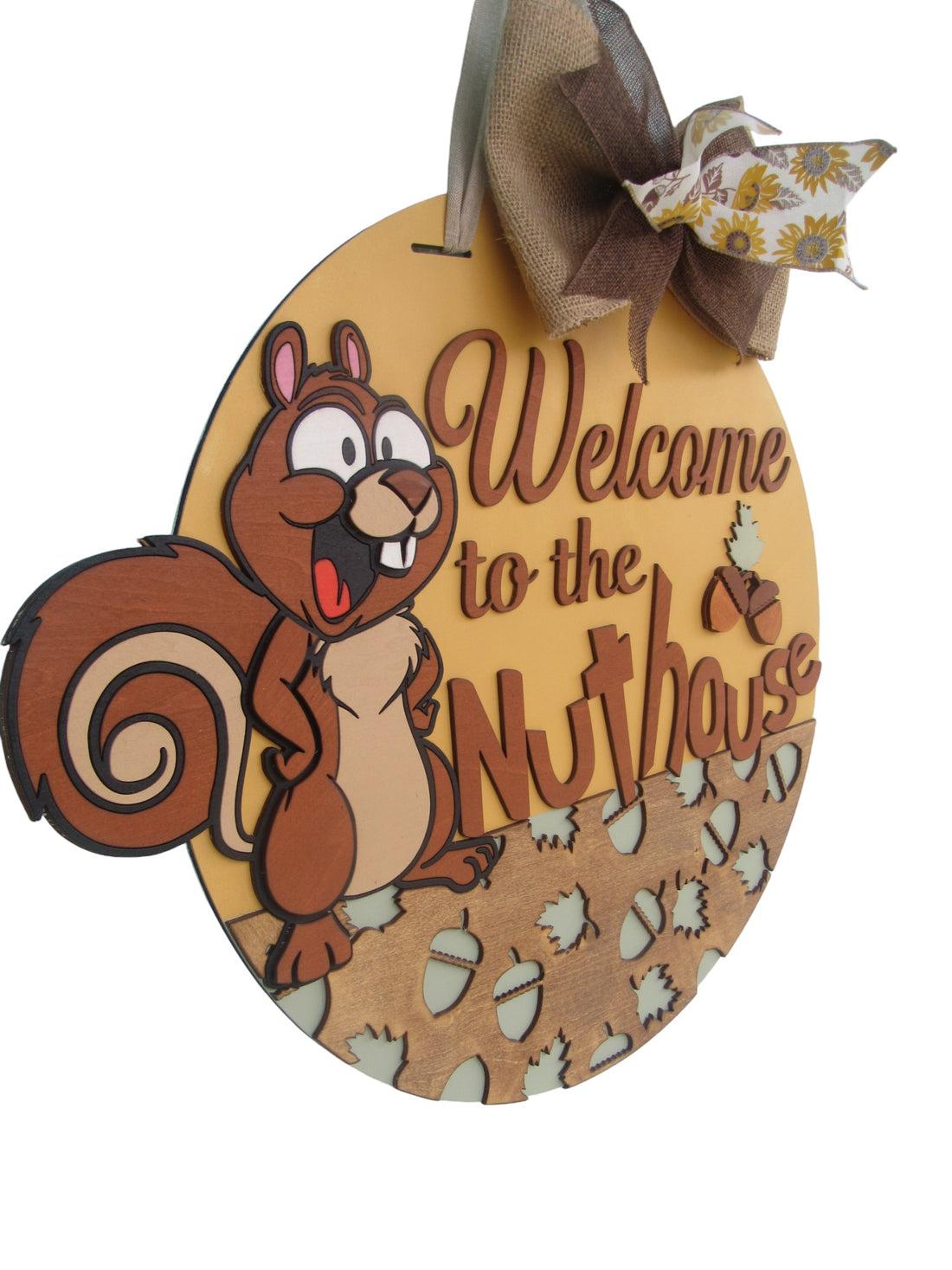 Brown and tan squirrel welcome door hanger with multi-layered text, perfect for woodland or rustic home styles.
