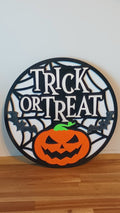 Halloween Trick or Treat sign with multi-layered 3D design, spider web pattern, and vivid glitter bat accents.