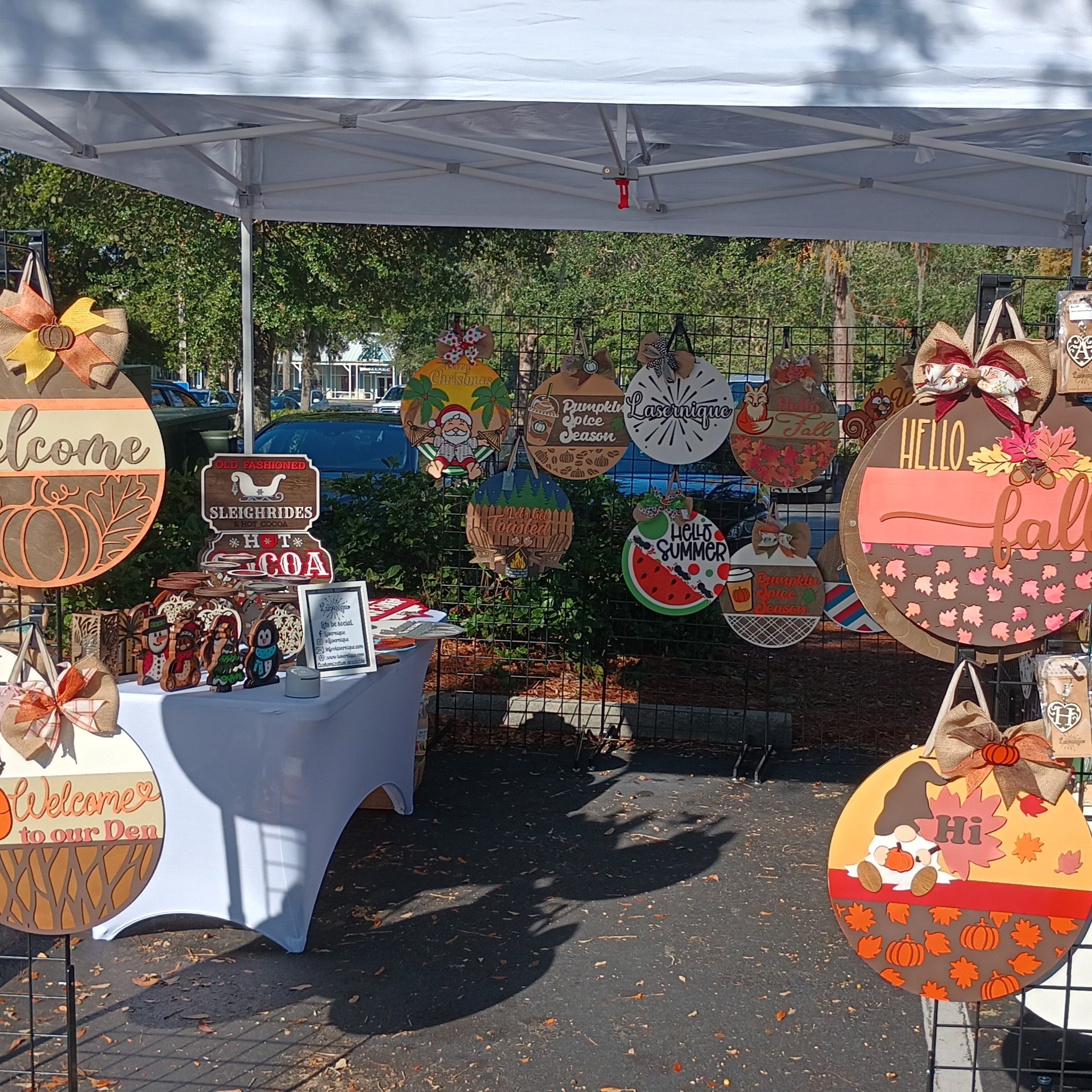 Lasernique fall craft show setup outdoors under a tent