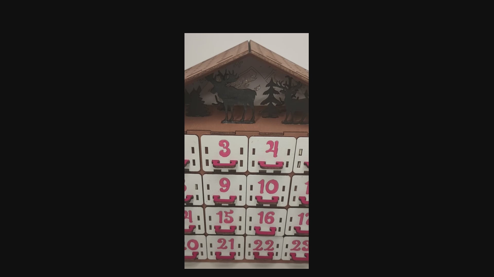 Video  of wooden advent calendar with deep drawers for small gifts and treats.