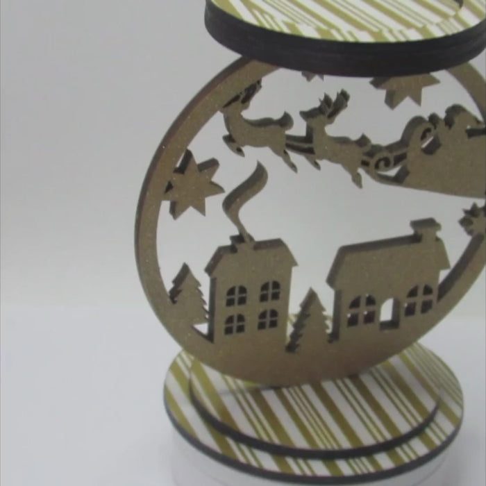 Glittery Santa sleigh candle holder, 8x9 inches, perfect for holiday table centerpiece or mantel decoration.