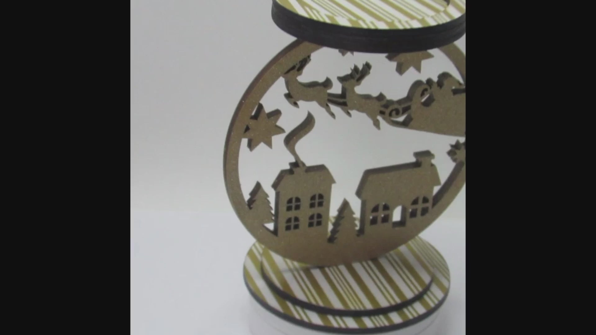 Glittery Santa sleigh candle holder, 8x9 inches, perfect for holiday table centerpiece or mantel decoration.