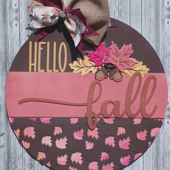 Rustic Hello Fall welcome sign with wood cutout script and acorn accents