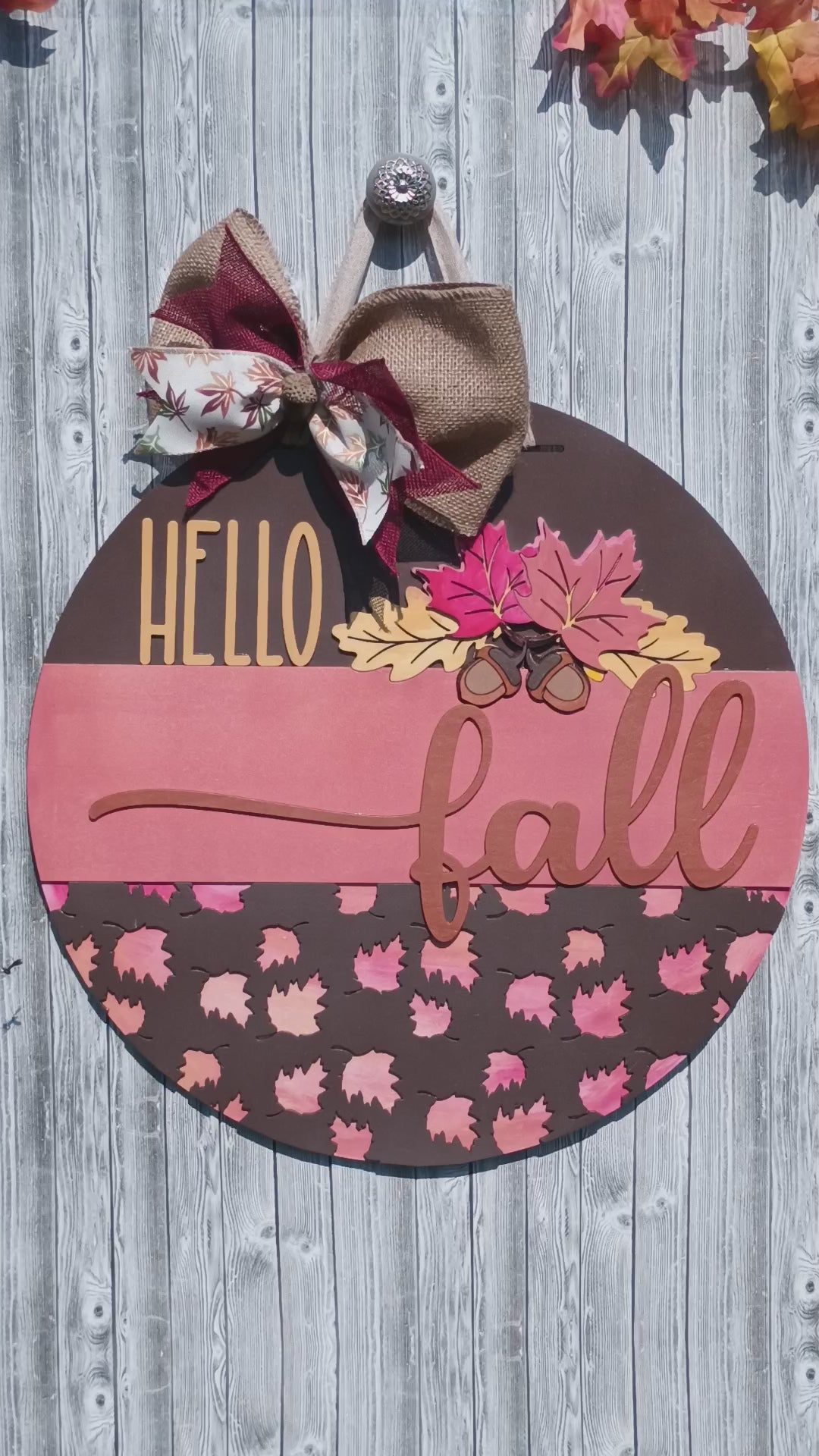 Rustic Hello Fall welcome sign with wood cutout script and acorn accents