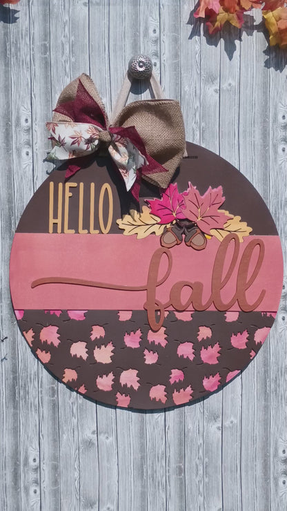Rustic Hello Fall welcome sign with wood cutout script and acorn accents