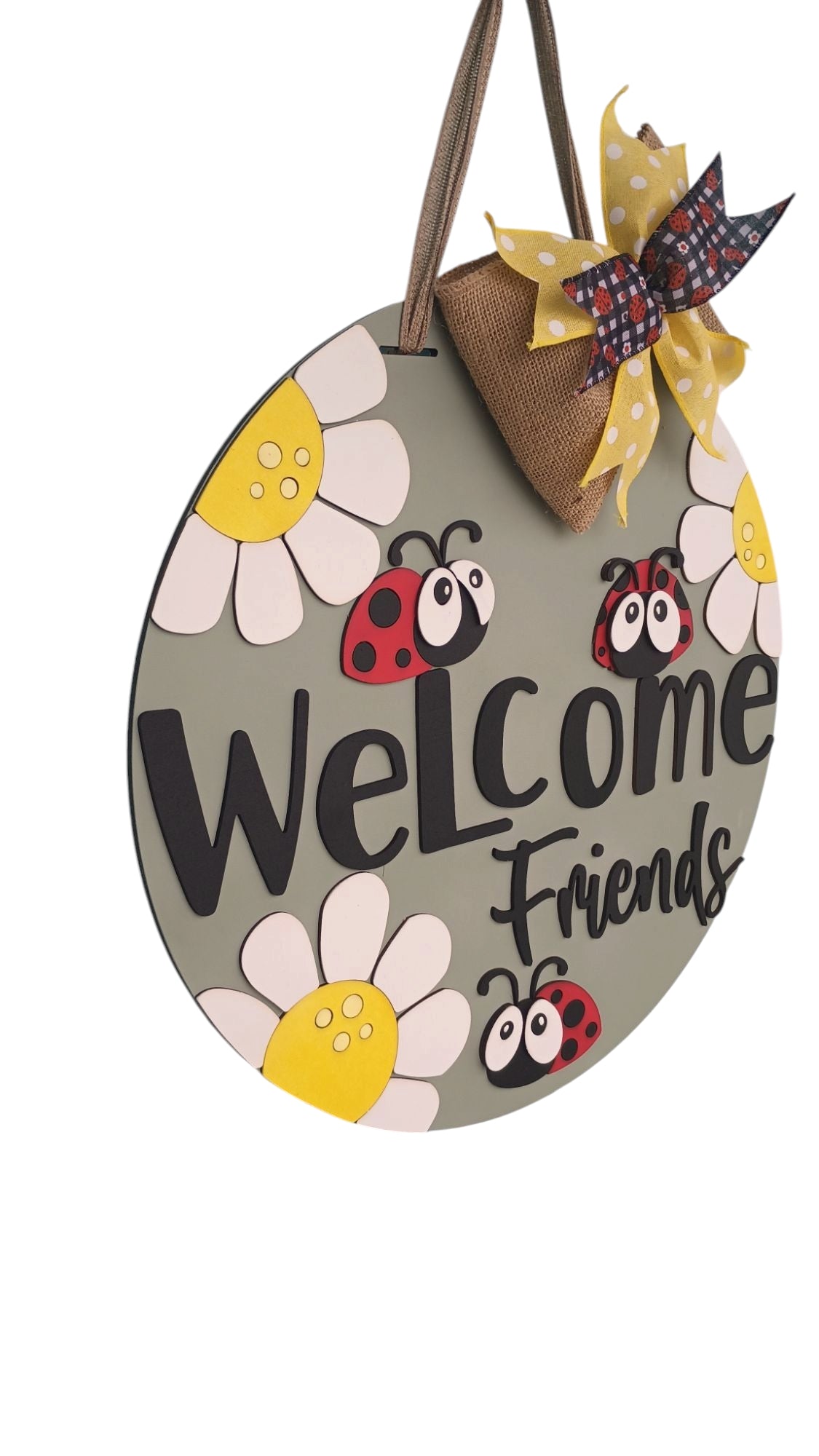 Large round ladybug welcome sign with triple-layer bow