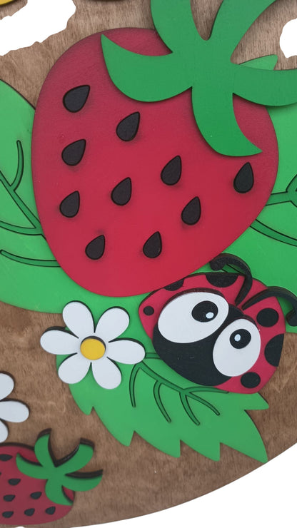 round wood sign with strawberry theme and daisies