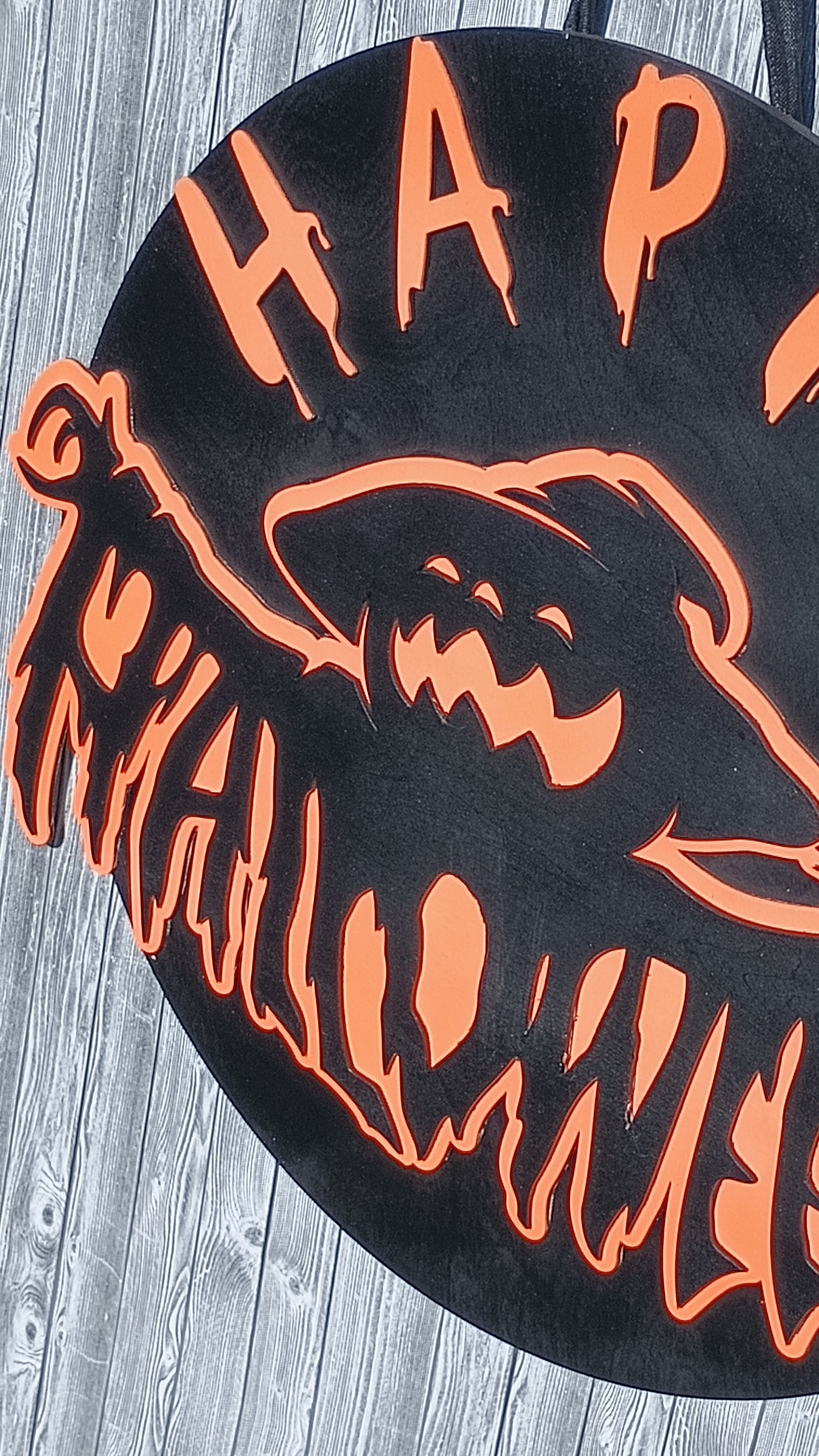 Round wooden Halloween sign with layered ghost design