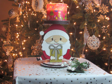 Wooden Santa Candle Holder displayed with a lit bath and body works candle, ideal for cozy Christmas decorations.