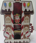 Holiday-themed Santa's house advent calendar adorned with candy canes for Christmas celebration