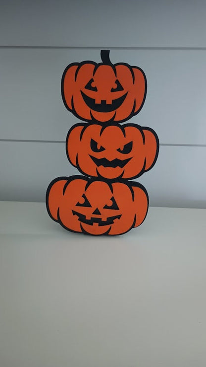 Halloween shelf sitter featuring spooky pumpkin stack