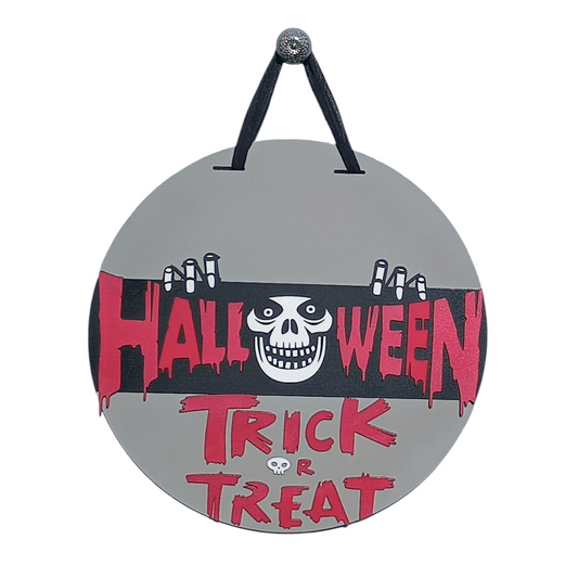 Trick or Treat Halloween sign with skeleton face and red lettering