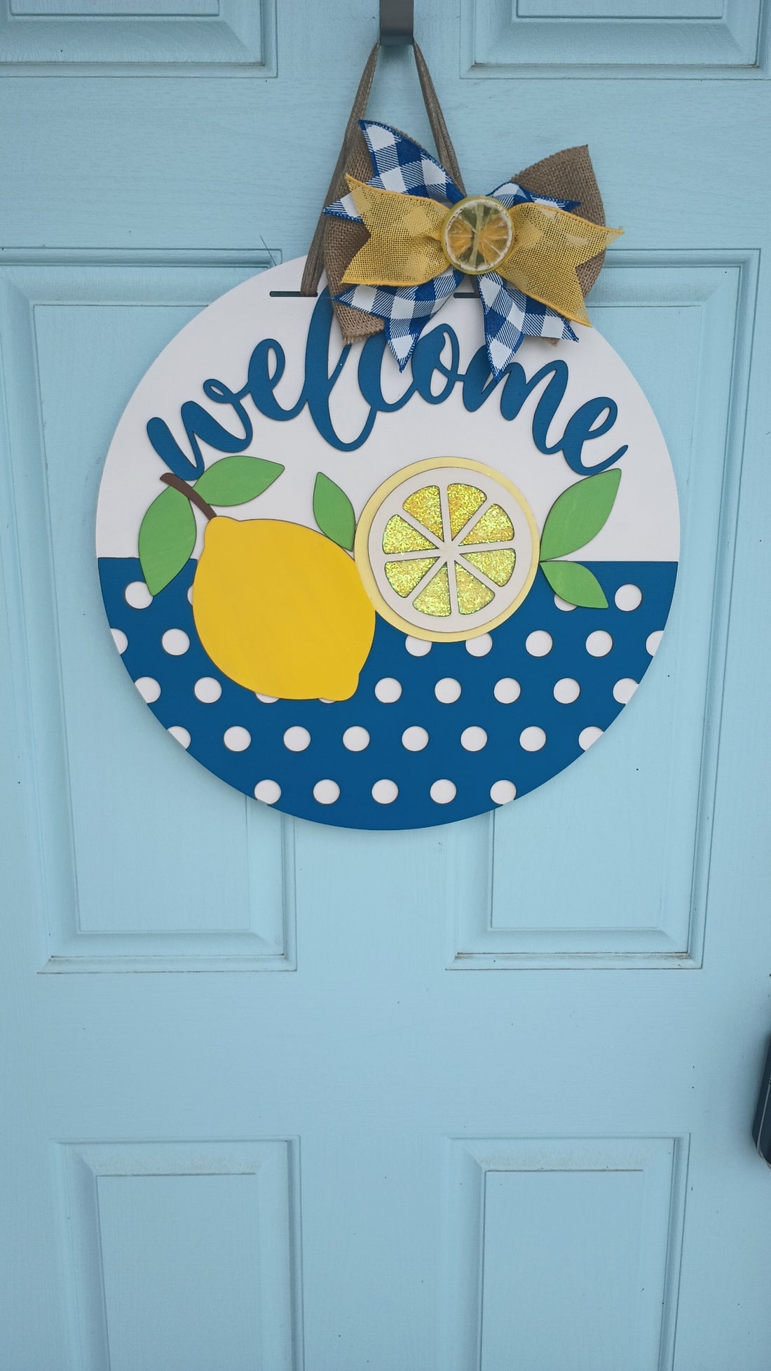 Vibrant yellow lemon door hanger with layered 3D design, perfect for summer kitchen or entryway decor.
