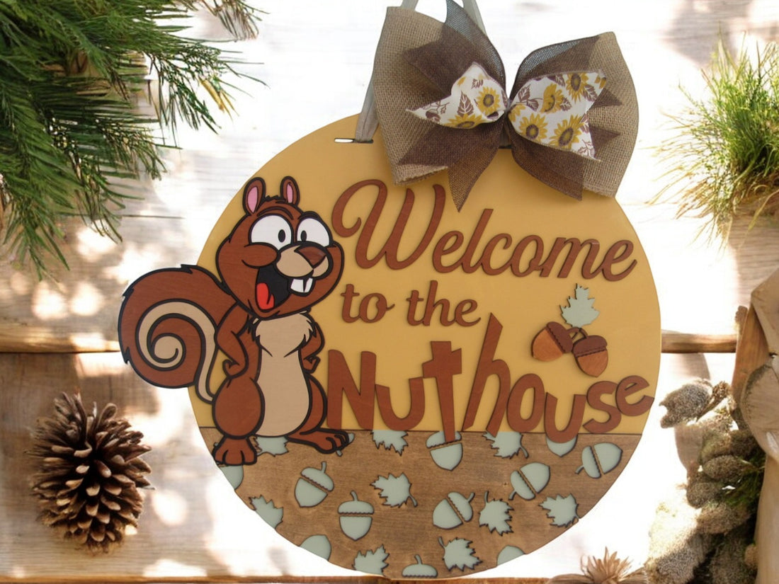 Funny “Welcome to the Nuthouse” door sign with 3D wood cutouts and cartoon squirrel character for humorous home decor.
