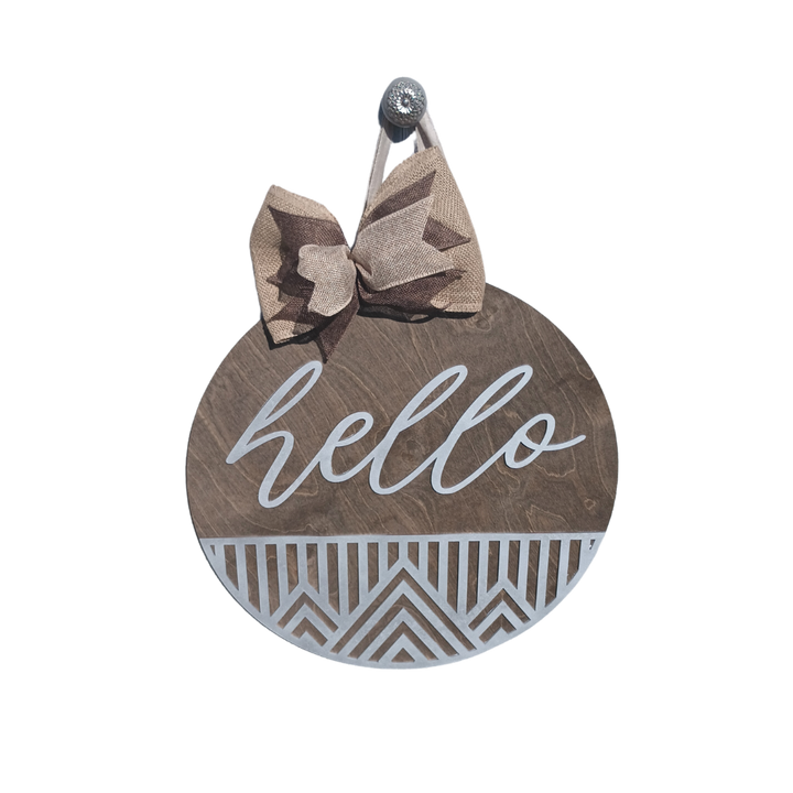 Hello door hanger with geometric cutout design and burlap bow, perfect for front door decor.
